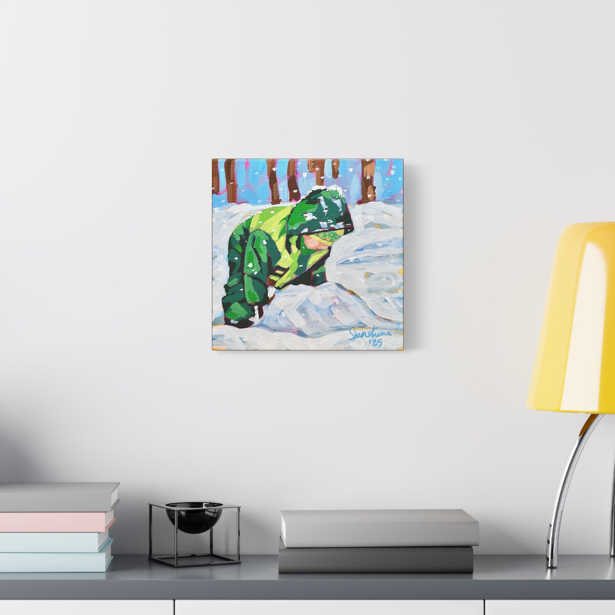 Child in Green Coat Playing in Snow Print on Canvas